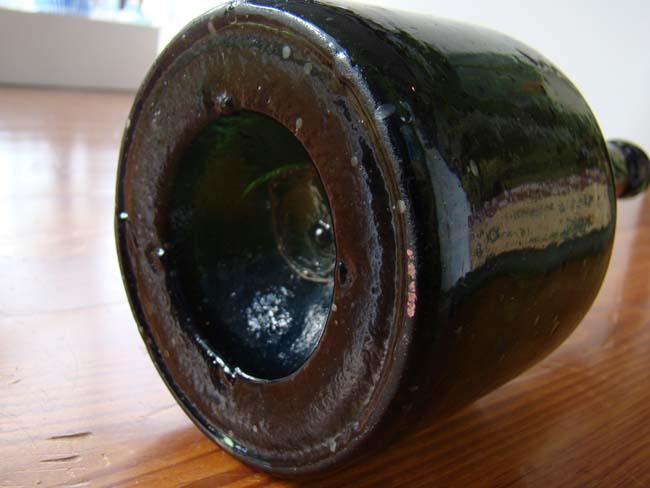 An unusually tall and rare 18th century English green glass wine bottle circa 1740 — image 4